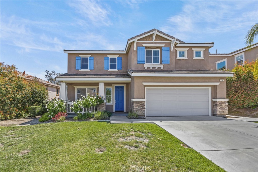 126 Boston Beaumont, CA 92223 - Photo 1 of 1 a front view of a house with a garden and plants