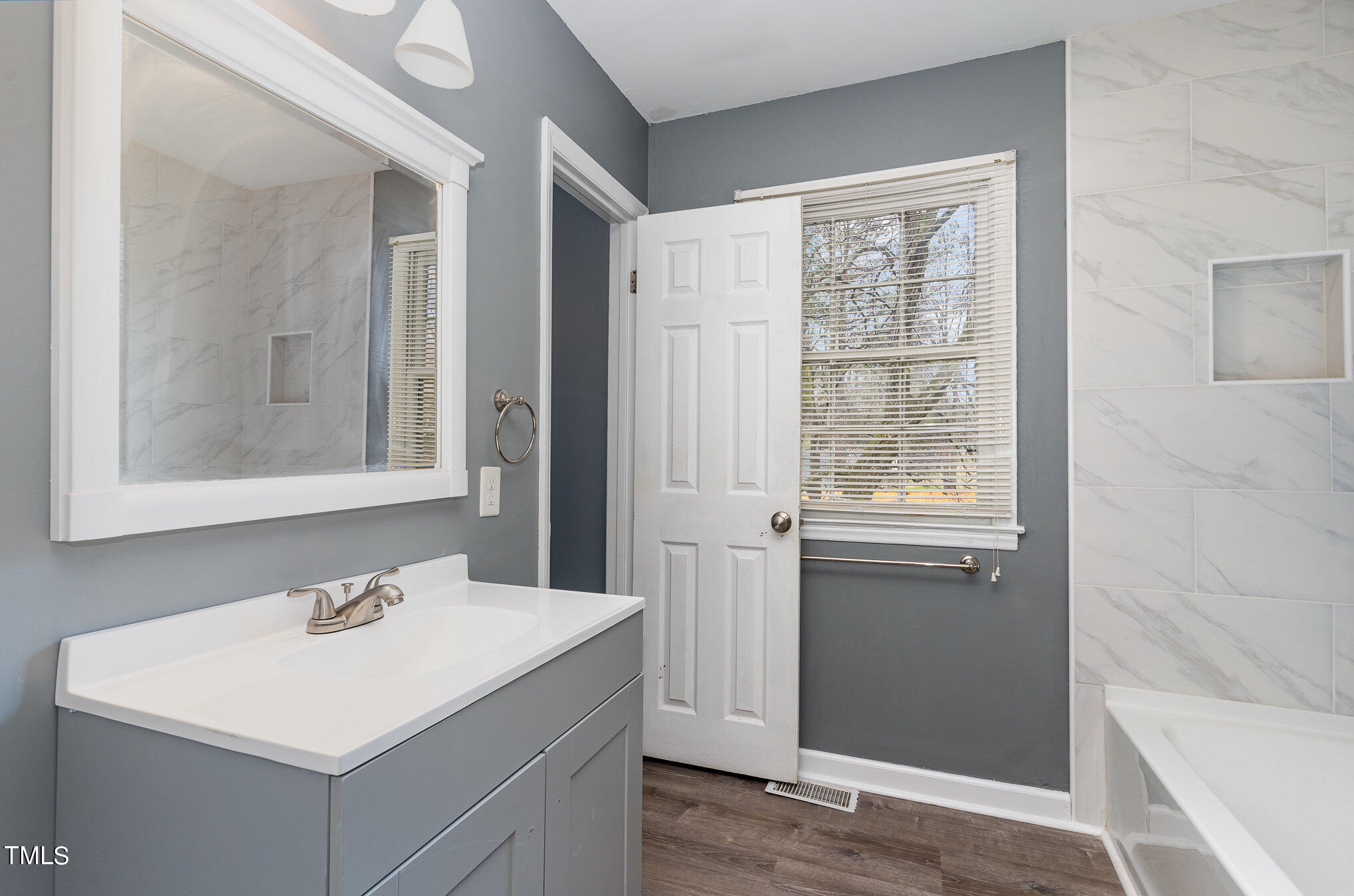 4100 Kilcullen Drive Raleigh, NC 27604 - Photo 11 of 19 a bathroom with a sink and a mirror