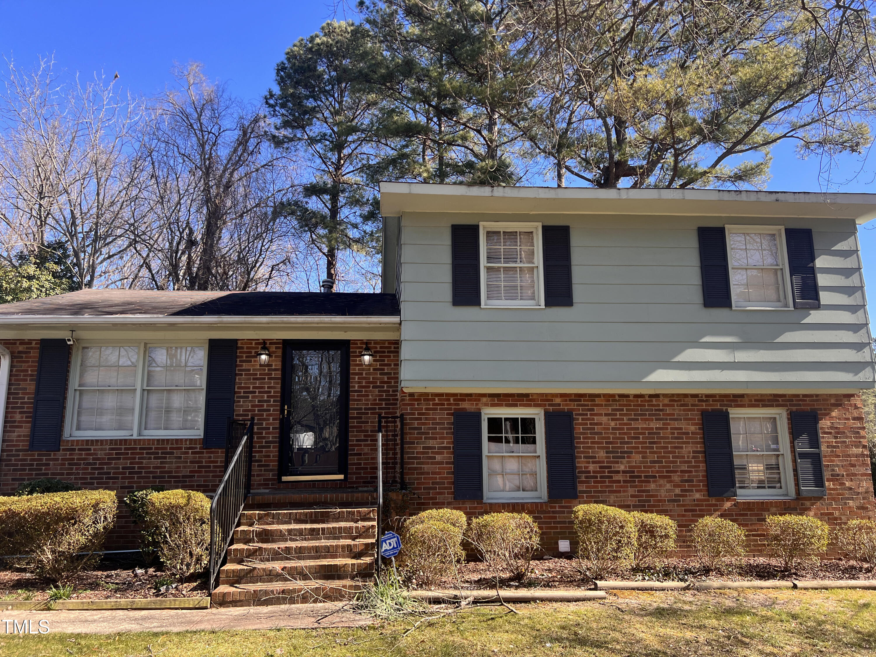 4100 Kilcullen Drive Raleigh, NC 27604 - Photo 3 of 19 a front view of a house with garden and tree