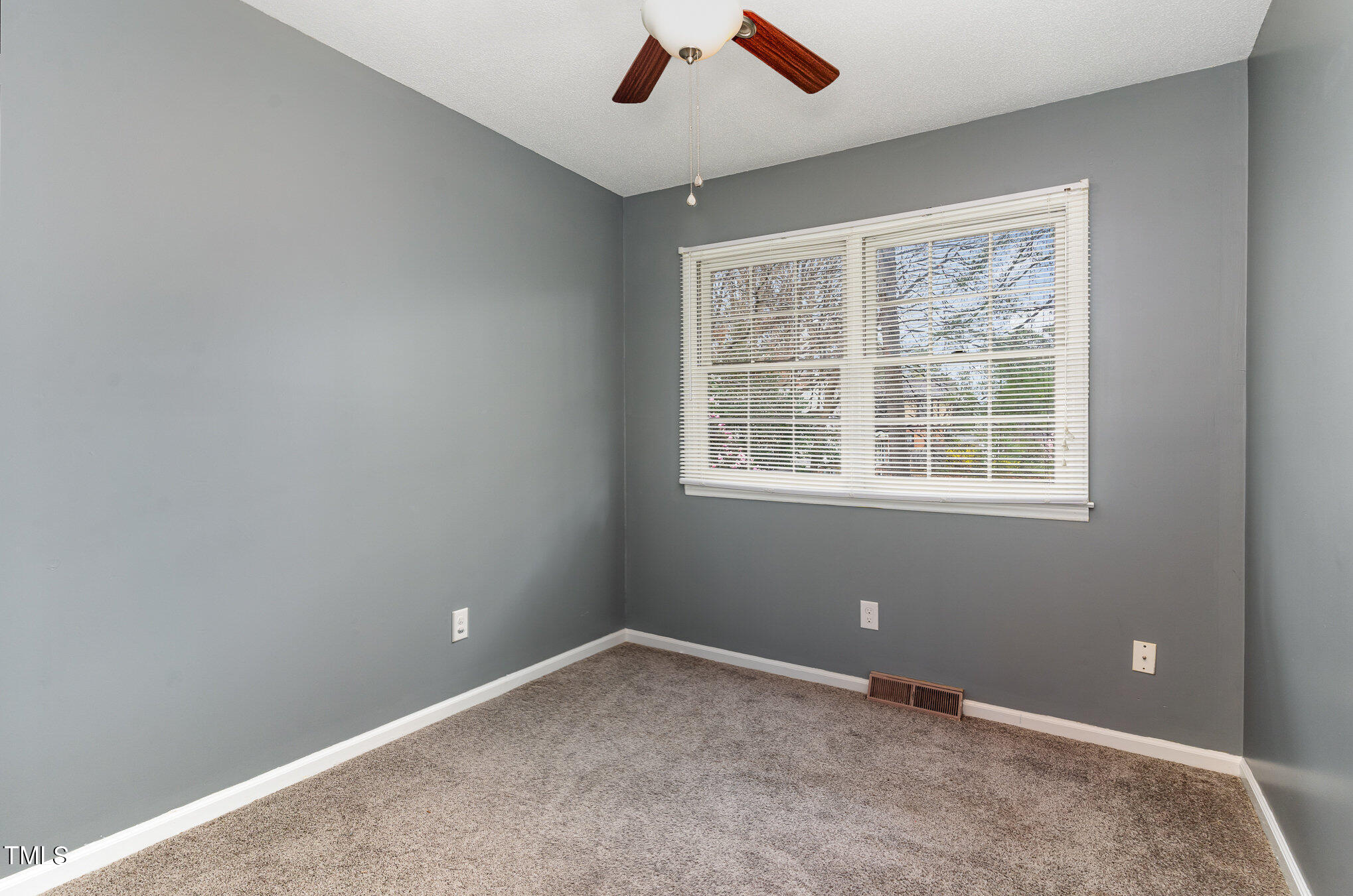 4100 Kilcullen Drive Raleigh, NC 27604 - Photo 10 of 19 a view of an empty room with a window