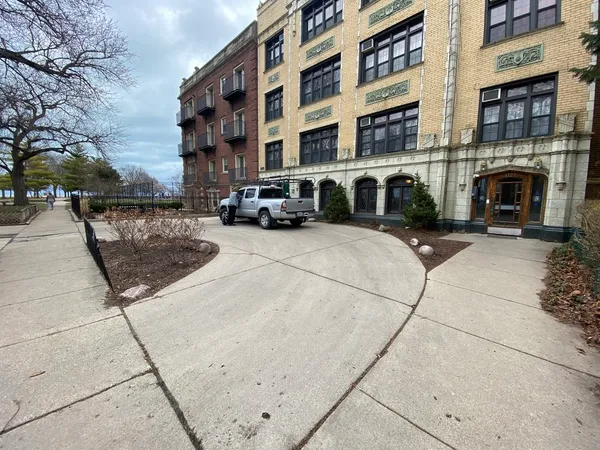 a view of a building with sitting area