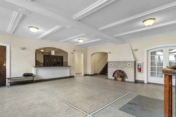 a view of a livingroom with furniture and a flat screen tv