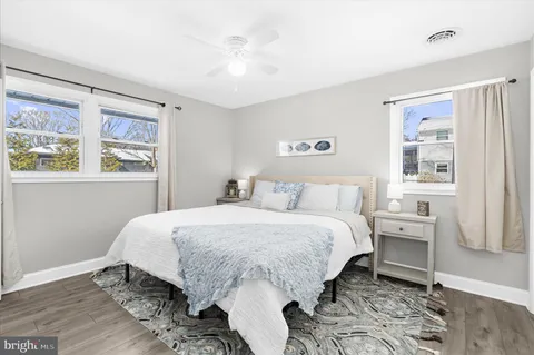 a bathroom with a sink a mirror and window