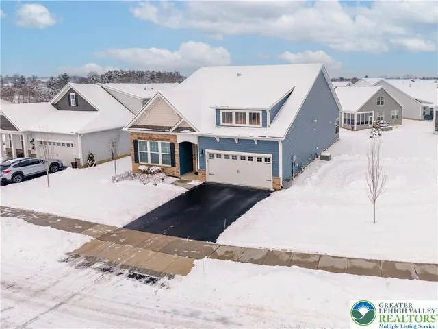 a bedroom with a bed and a dresser in it