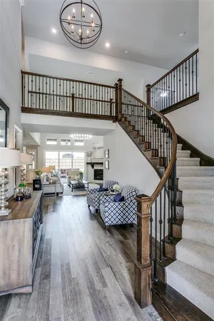 a view of entryway livingroom and hall with wooden floor