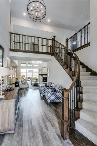 a view of entryway livingroom and hall with wooden floor