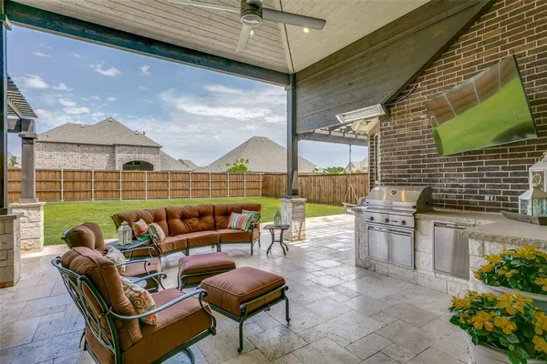 a outdoor living space with furniture and garden view
