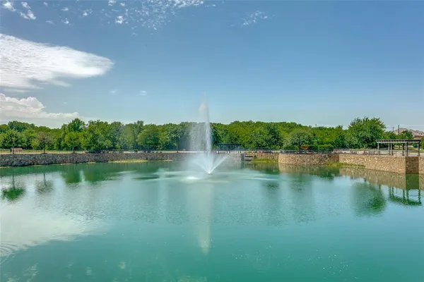 a view of lake with green space