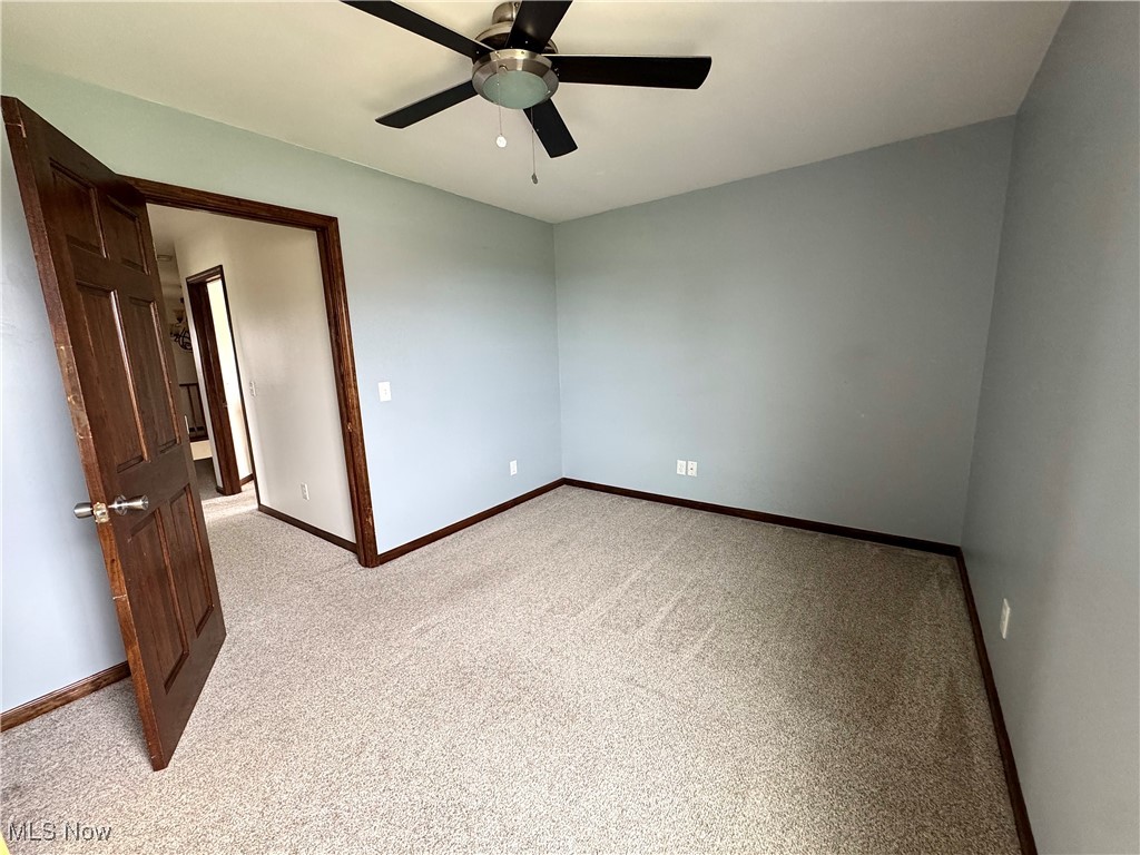 3450 Secrest Road Wooster, OH 44691 - Photo 28 of 34 Bedroom with carpet floors, a ceiling fan