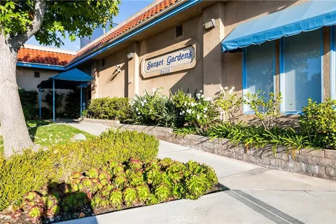 a view of a street with flower plants