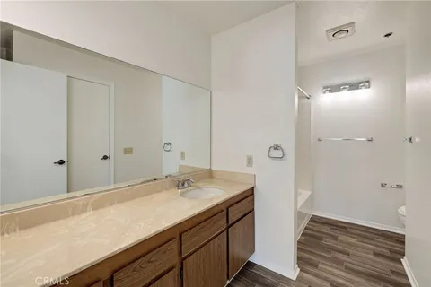 a bathroom with a bathtub sink and mirror