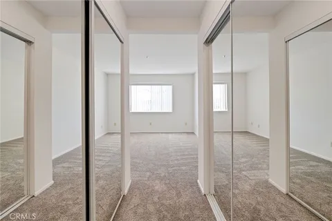 a view of empty room with a fireplace