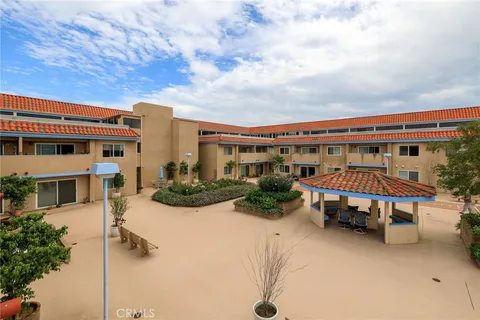 a view of a swimming pool with seating area and furniture
