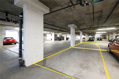 a view of parking garage with cars