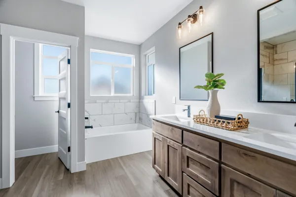 a white bath tub sitting next to a white toilet