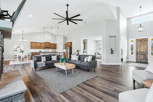 a living room with fireplace furniture and a flat screen tv