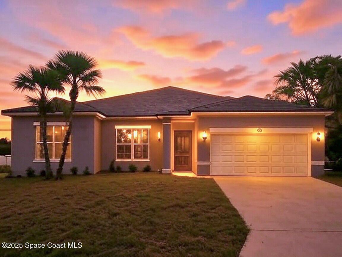 a front view of a house with a yard