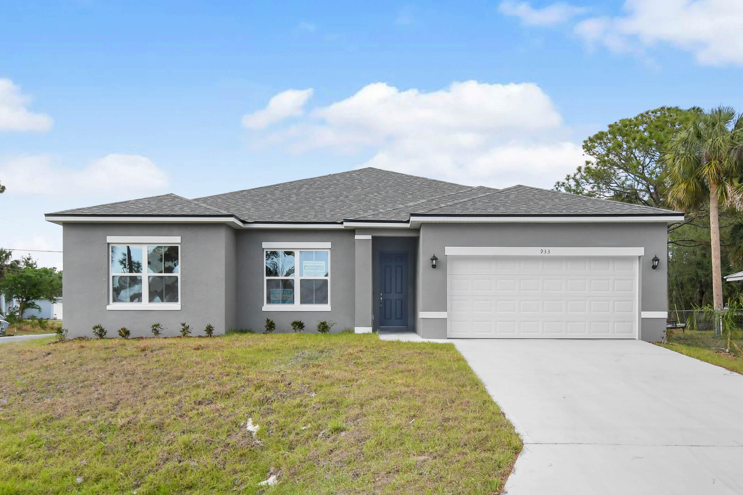933 Tupelo Road Southwest Palm Bay, FL 32908 - Photo 28 of 31 front view of a house with a garage