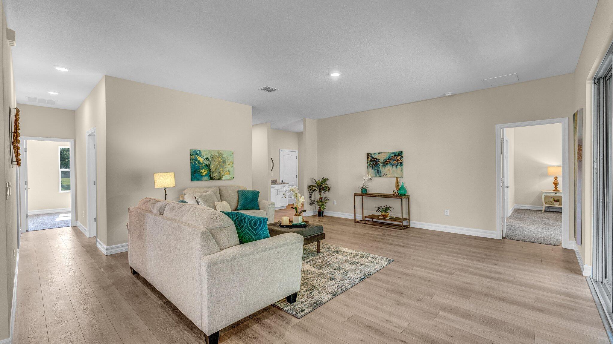 933 Tupelo Road Southwest Palm Bay, FL 32908 - Photo 8 of 31 a living room with furniture and wooden floor