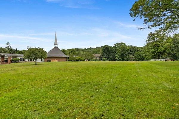 a view of a lake with a big yard