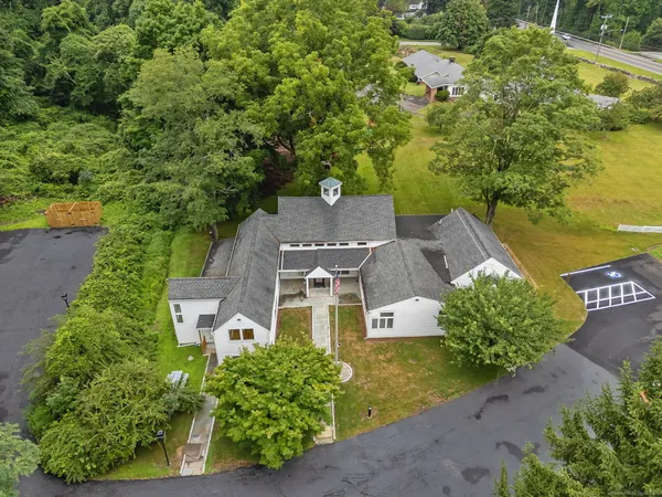an aerial view of a house with a garden
