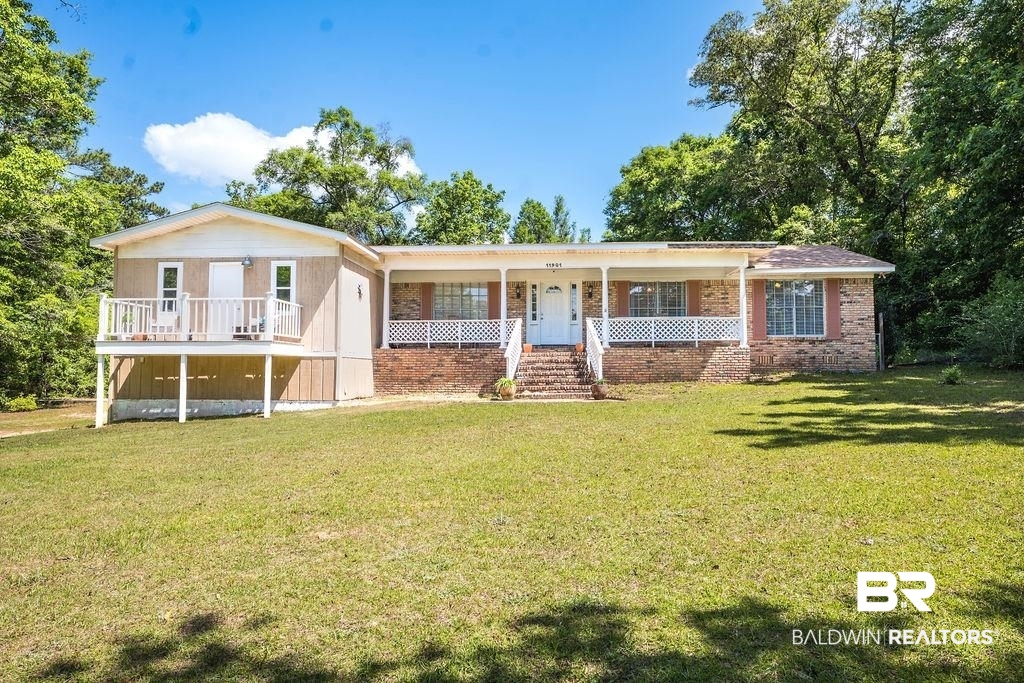 11901 Old Moffat Road Wilmer, AL 36587 - Photo 1 of 39 Ranch-style home featuring a front yard, brick siding, and a porch