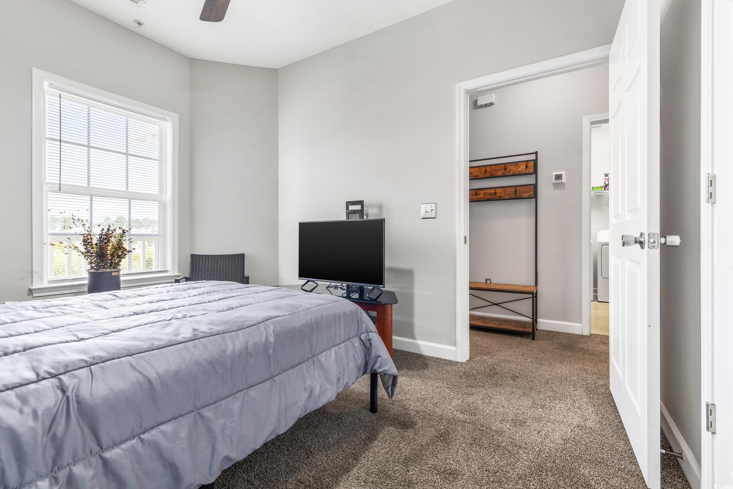 213 Wando River Road, Unit E Myrtle Beach, SC 29579 - Photo 11 of 28 Bedroom featuring ceiling fan and dark carpet