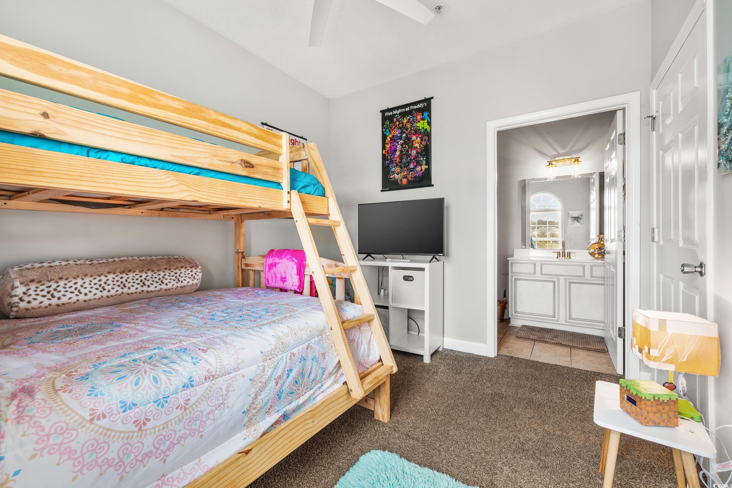 Bedroom featuring carpet flooring and ceiling fan