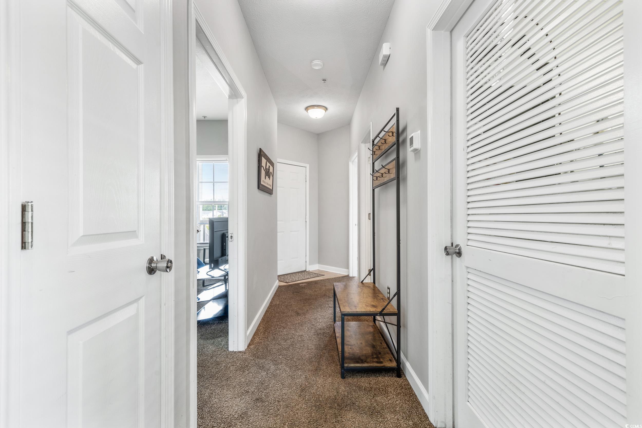 213 Wando River Road, Unit E Myrtle Beach, SC 29579 - Photo 9 of 28 Full bathroom with vanity, tile patterned floors,