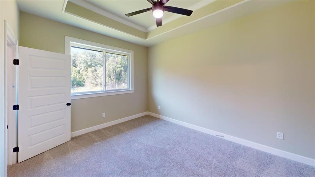 2510 Windmillln Windmill Lane Longview, TX 75601 - Photo 18 of 35 an empty room with windows and fan