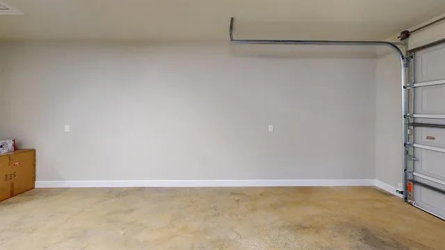 a kitchen with stainless steel appliances kitchen island granite countertop a stove refrigerator and cabinets