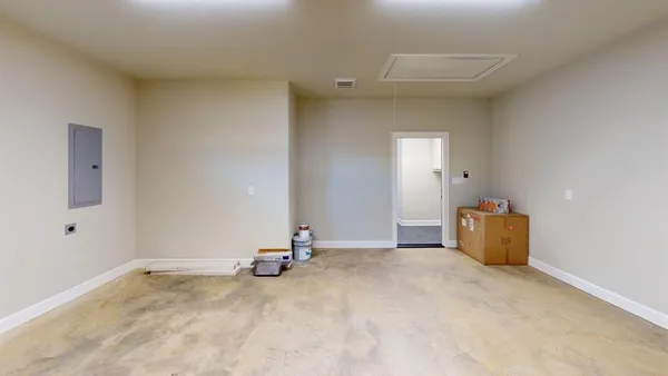 a large kitchen with stainless steel appliances kitchen island granite countertop a stove a refrigerator a sink dishwasher and a wooden cabinets with wooden floor