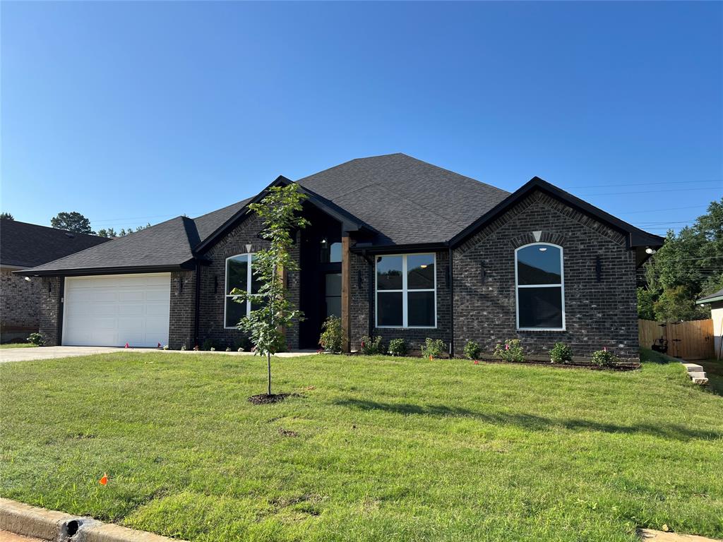 2510 Windmillln Windmill Lane Longview, TX 75601 - Photo 35 of 35 a front view of a house with a yard