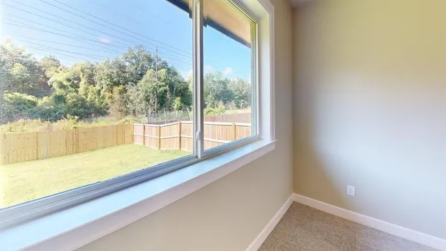 a view of an empty room and window
