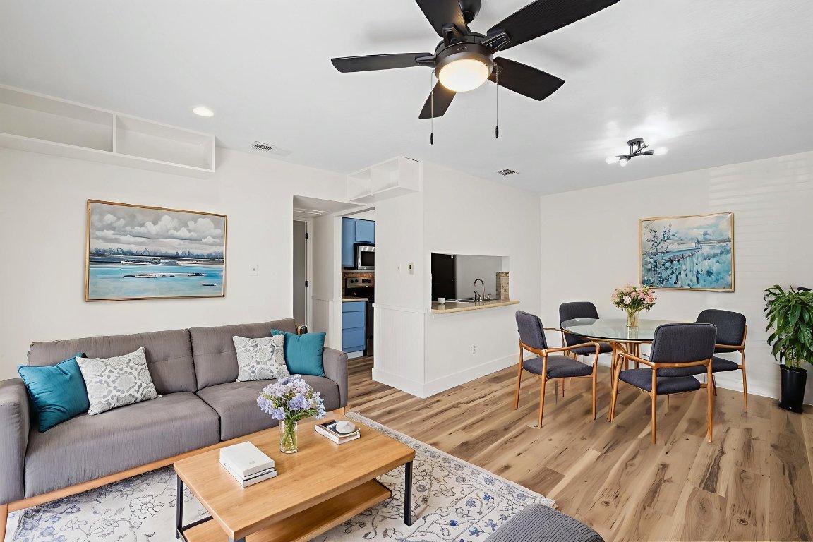 1705 Crossing Place, Unit 117B Austin, TX 78741 - Photo 1 of 33 a living room with furniture and a flat screen tv