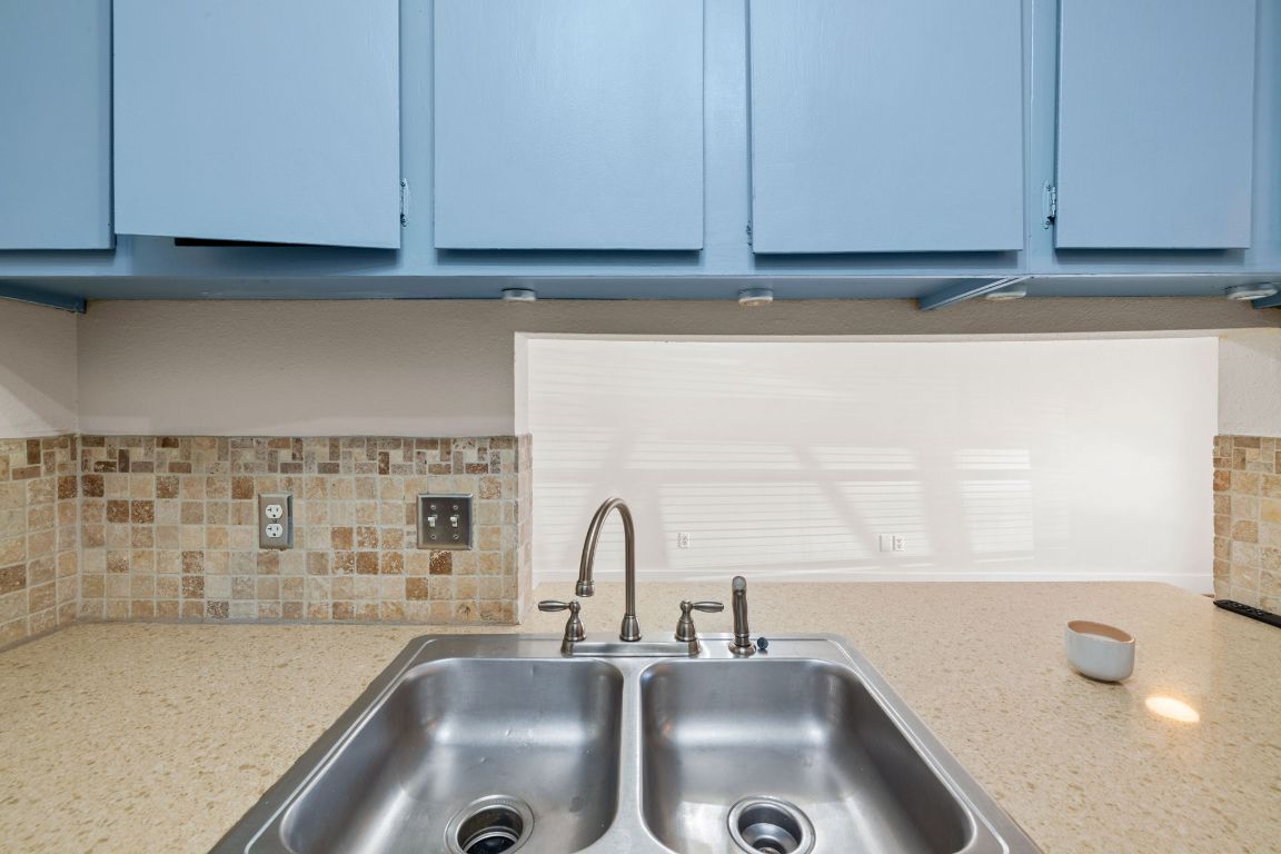 1705 Crossing Place, Unit 117B Austin, TX 78741 - Photo 12 of 33 a bathroom with a sink and a window