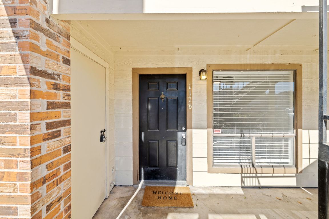 1705 Crossing Place, Unit 117B Austin, TX 78741 - Photo 28 of 33 a view of a brick house with a door