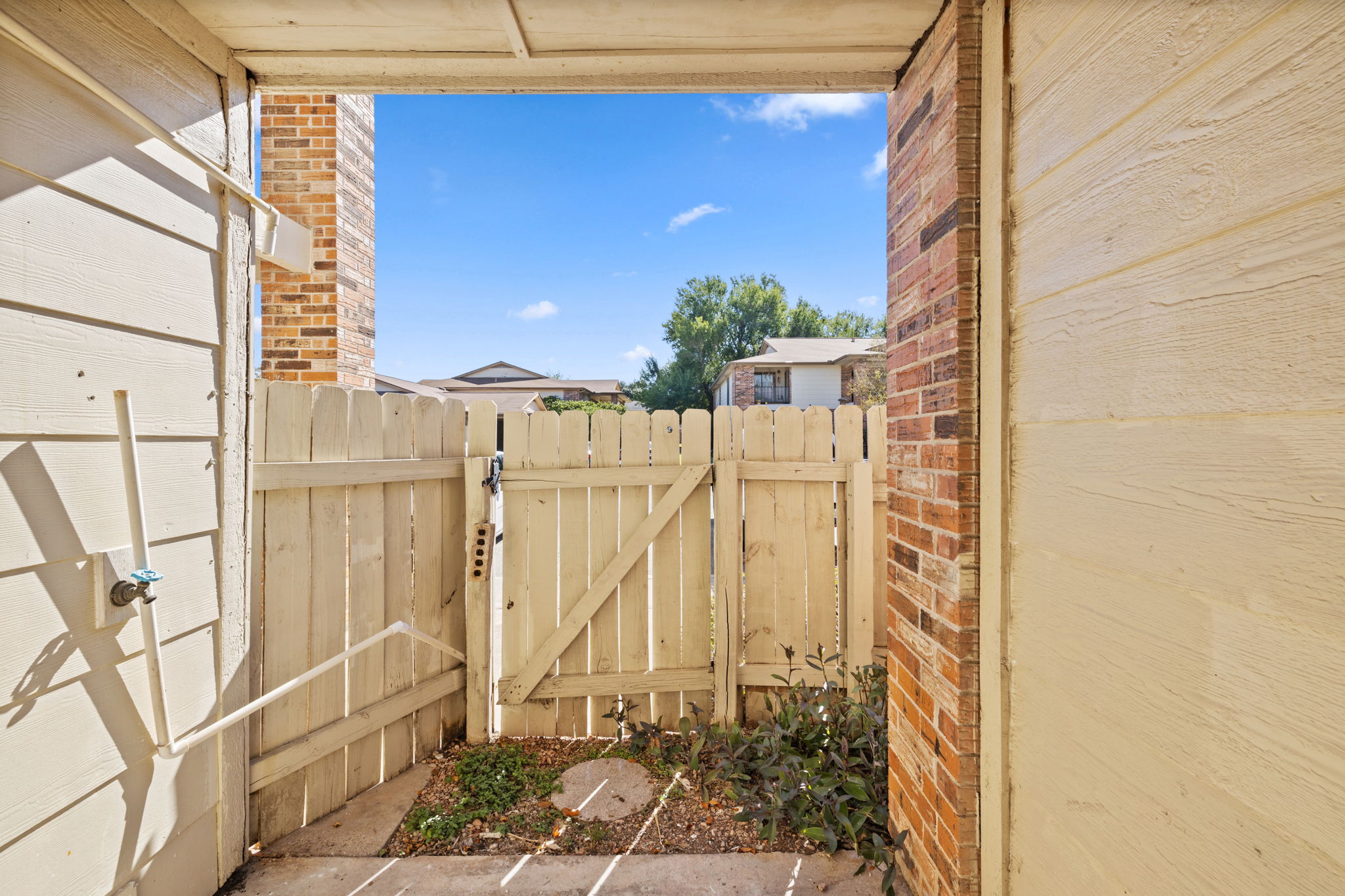 1705 Crossing Place, Unit 117B Austin, TX 78741 - Photo 31 of 33 Back patio off bedroom