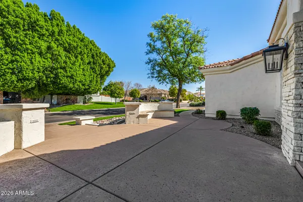 a living room with furniture a rug and a chandelier