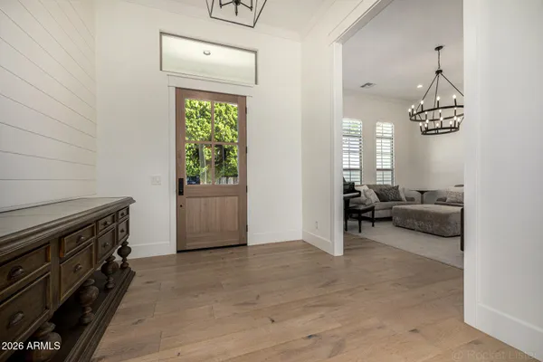 a view of a dining room with furniture and wooden floor