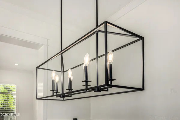 a kitchen with a sink a counter top space stainless steel appliances and cabinets