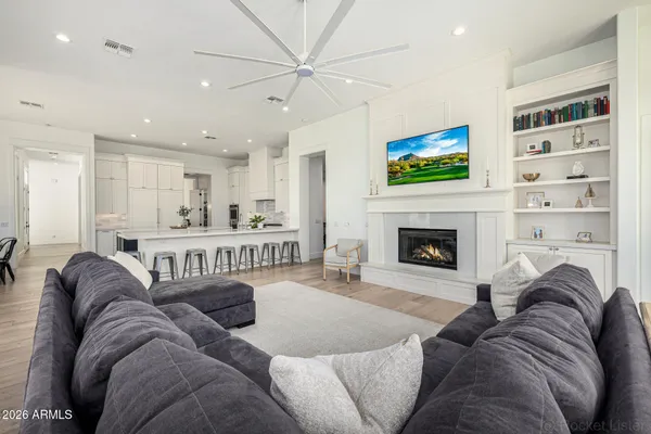 a kitchen with white cabinets and appliances