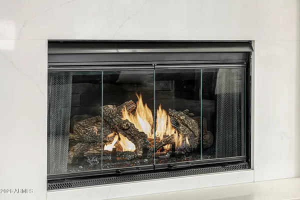 a bedroom with a large bed and a large window