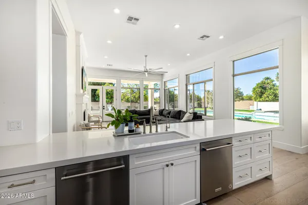 a bed room with a bed and a chair