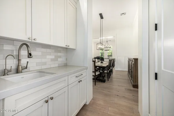 a en suite bathroom with a double vanity sink mirror and