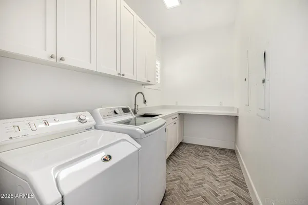 a bedroom with a bed and with furniture