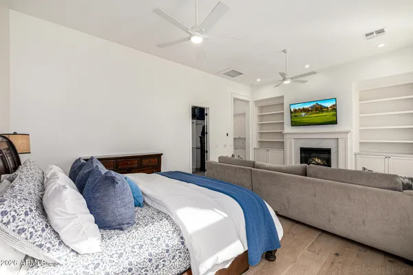 a living room with furniture ceiling fan and a window