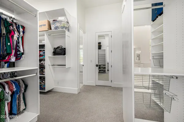 a bedroom with a bed and a book shelf