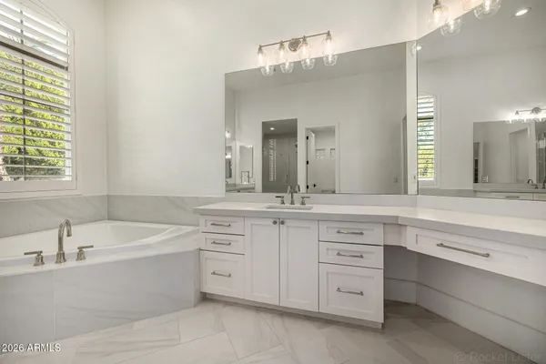 a view of a backyard with plants and trees