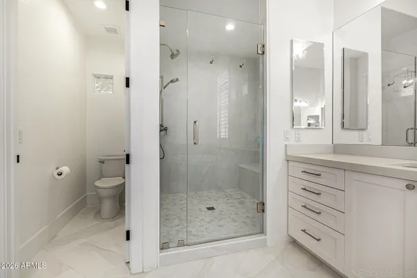 a view of a house with swimming pool and sitting area